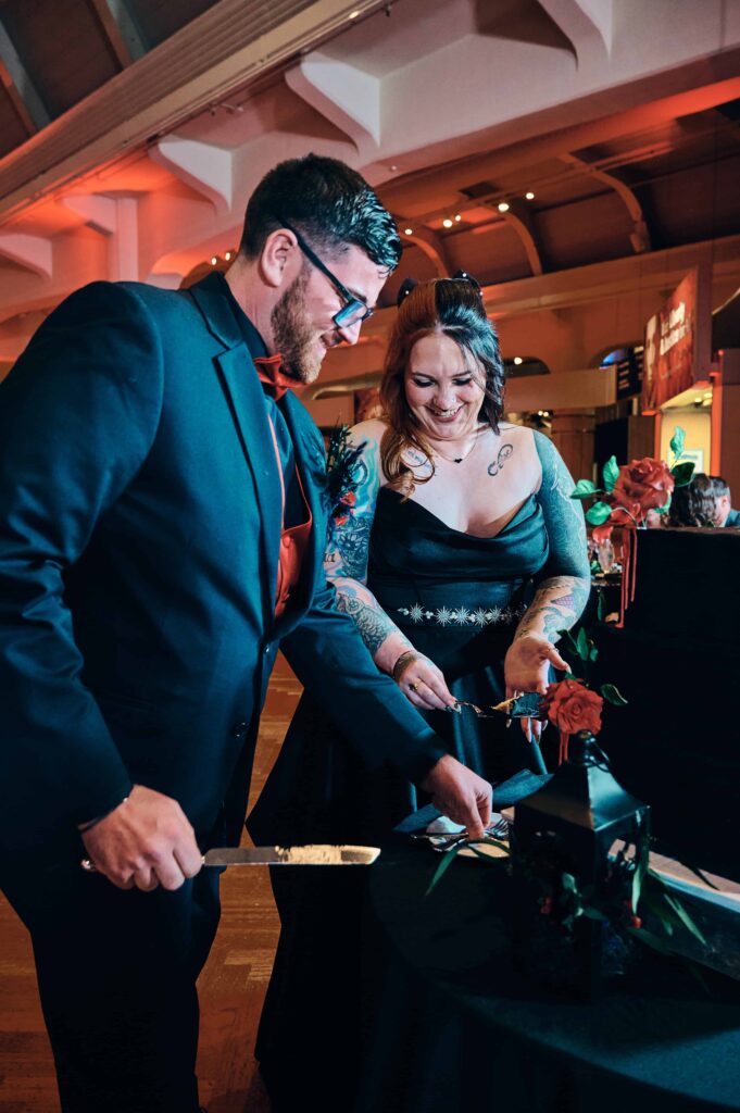 Bride and groom cut their wedding cake together