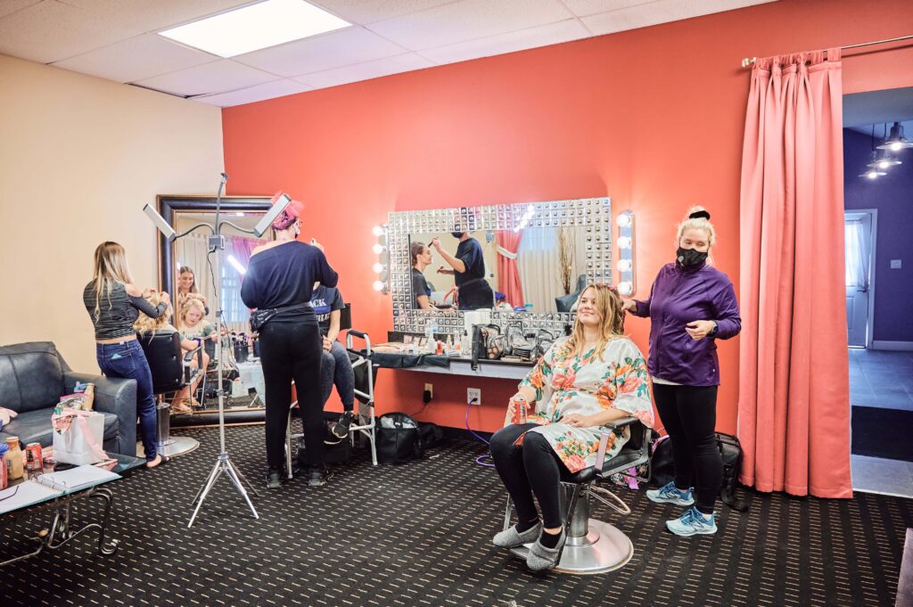 Bride gets ready with her bridesmaids at Silver Shores wedding venue in Wyandotte, Michigan