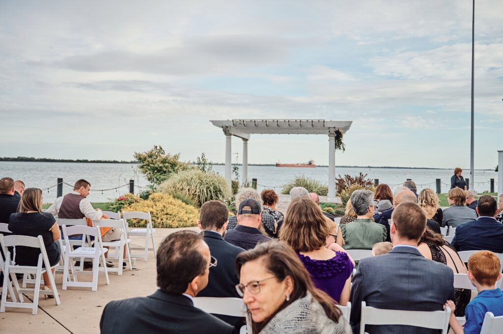 Freighter floats by at the ceremony spot at Silver Shores in Wyandotte, Michigan