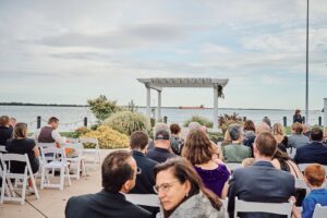Freighter floats by at the ceremony spot at Silver Shores in Wyandotte, Michigan