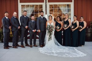 Wedding party with bride and groom outside of Sunset Hill Wedding Barn
