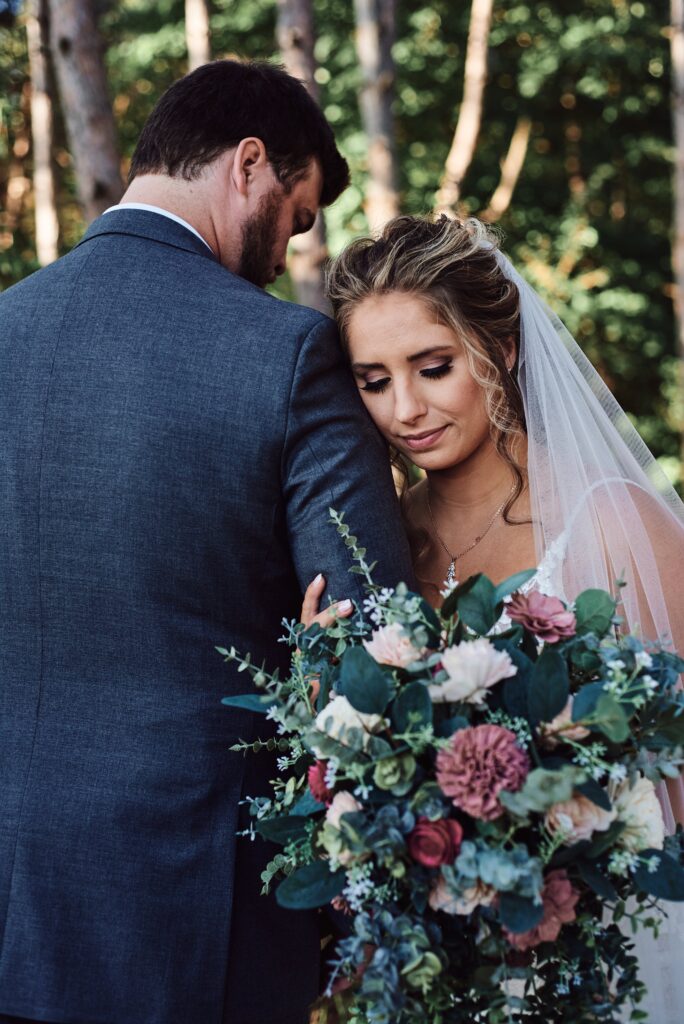 Bride and groom in woods at Sunset Hill Wedding Barn