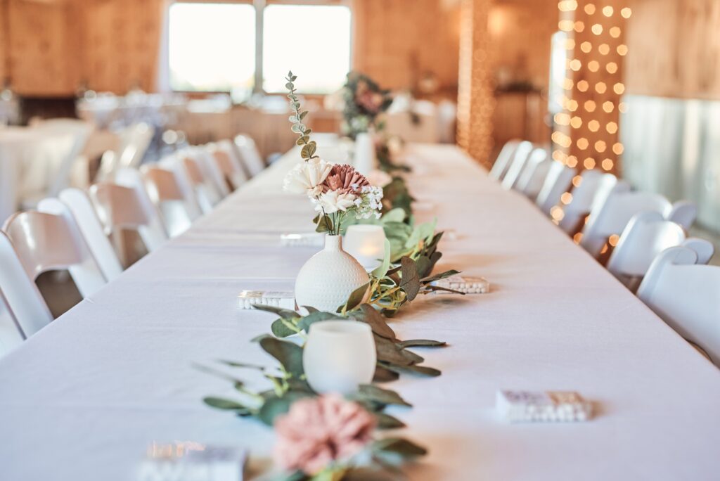 Table decor at a wedding at Sunset Hill Wedding Barn