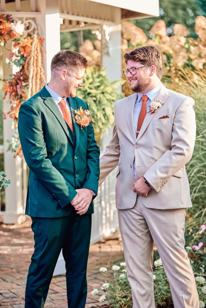 The best man consoles the groom as emotions start to stir at a wedding ceremony at Lapeer Country Club