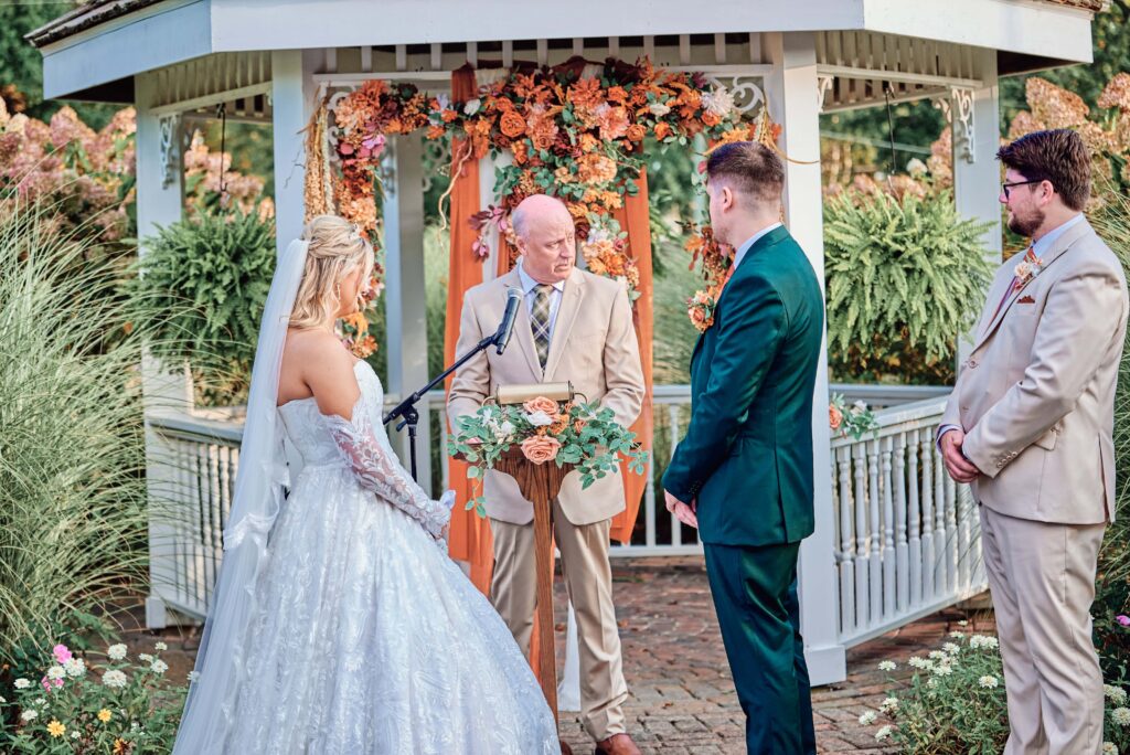 The bride and groom say "I do" at their wedding ceremony at Lapeer Country Club