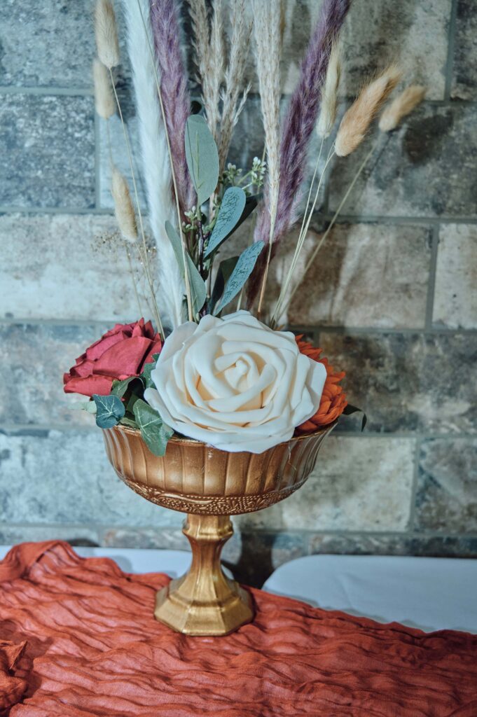 Bouquet display in gold chalice.
