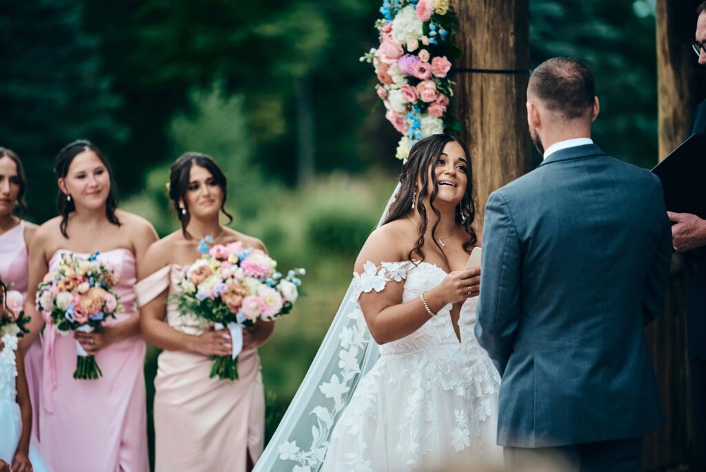 A brunette bride recites her personal vows to the groom during their wedding ceremony