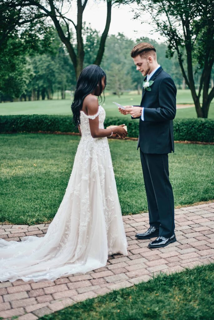 The bride and groom share private vows together after their first look and before their wedding ceremony